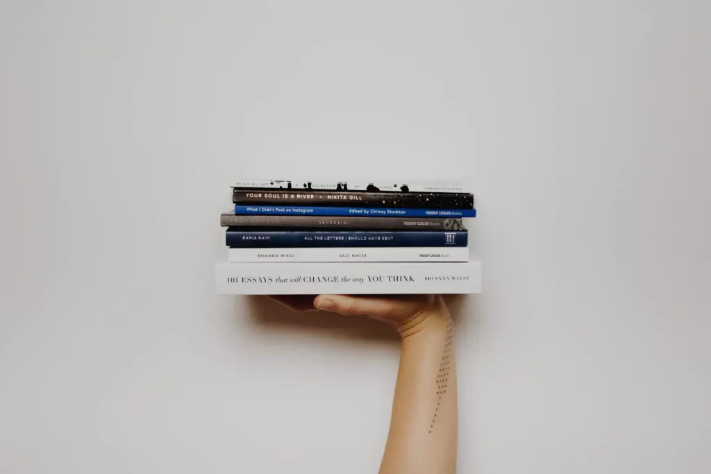 book-stacks-held-hand