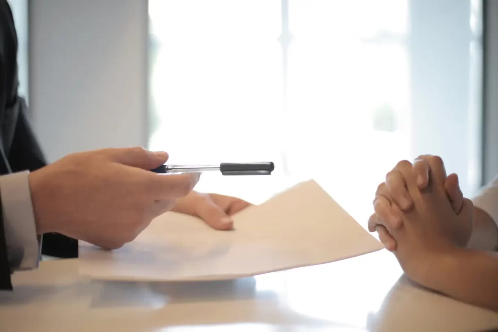 contract-signing-handing-ballpen