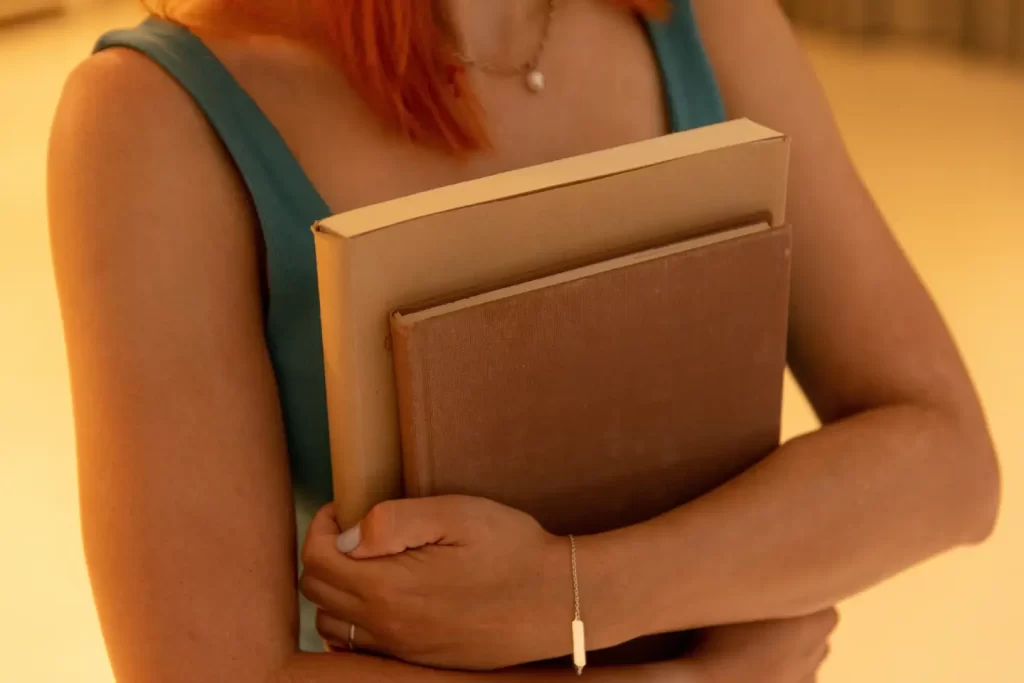 girl-hugging-two-books