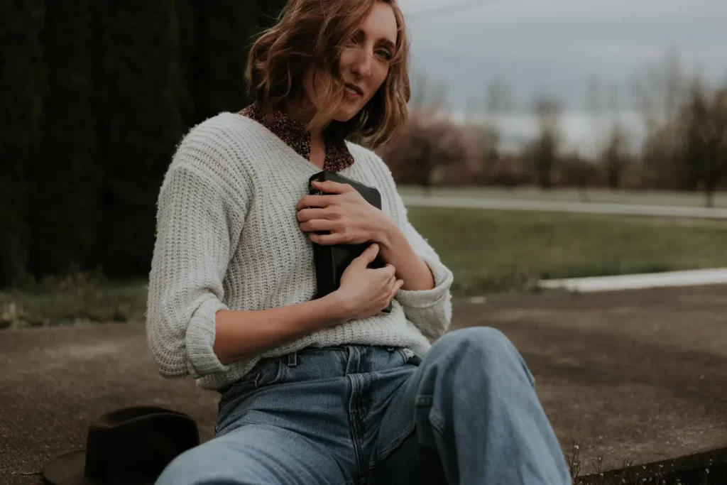 girl-sitting-hugging-book