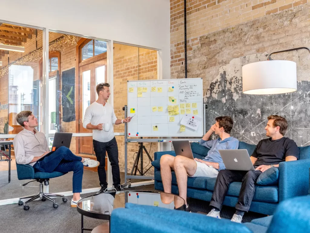 group-of-people-facing-white-board