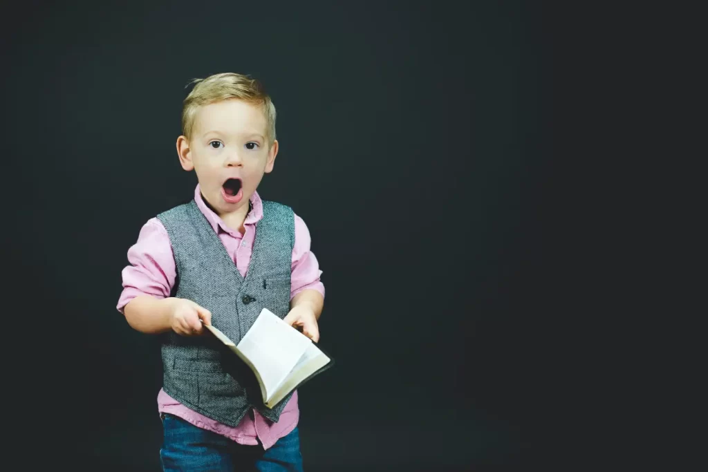 little-boy-shocked-reaction-holding-book