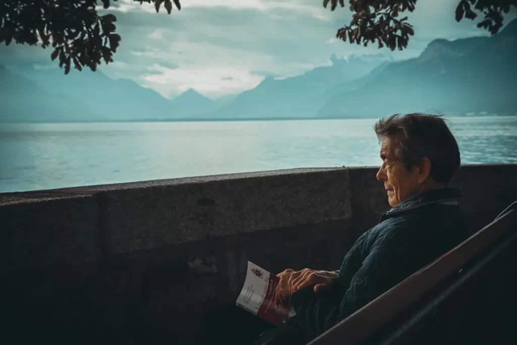 old-man-sitting-bench-reading-book