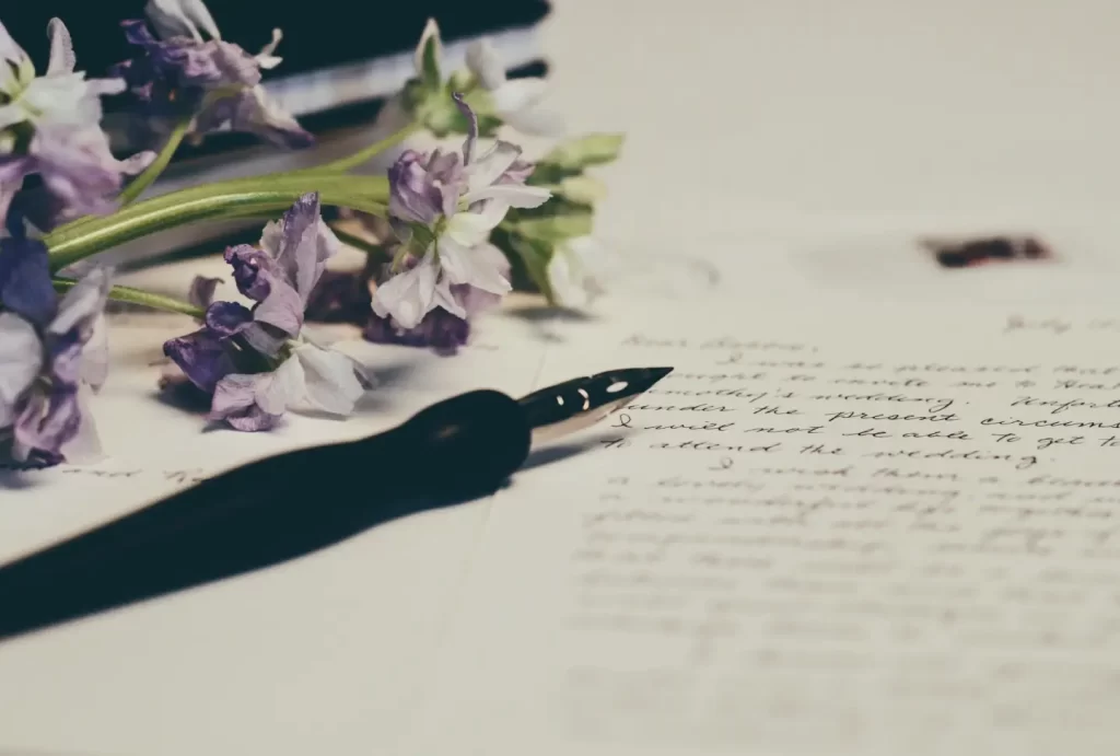 pen-with-violet-flower-handwritten-notes