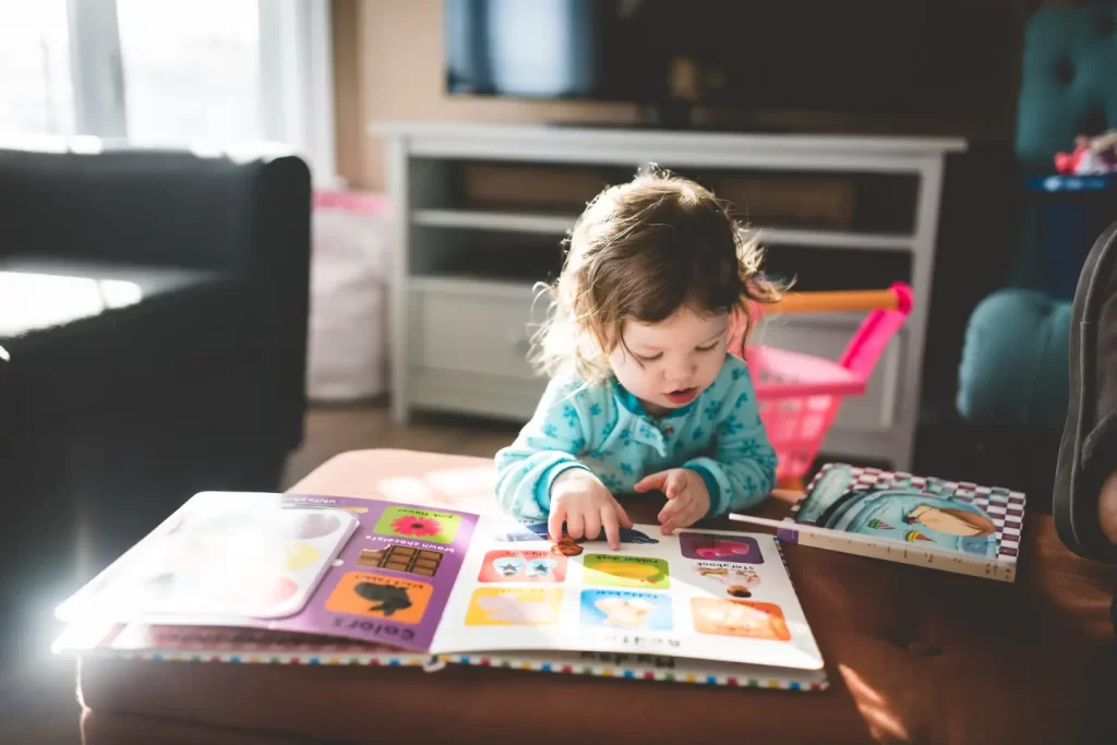 toddler-browsing-colored-book