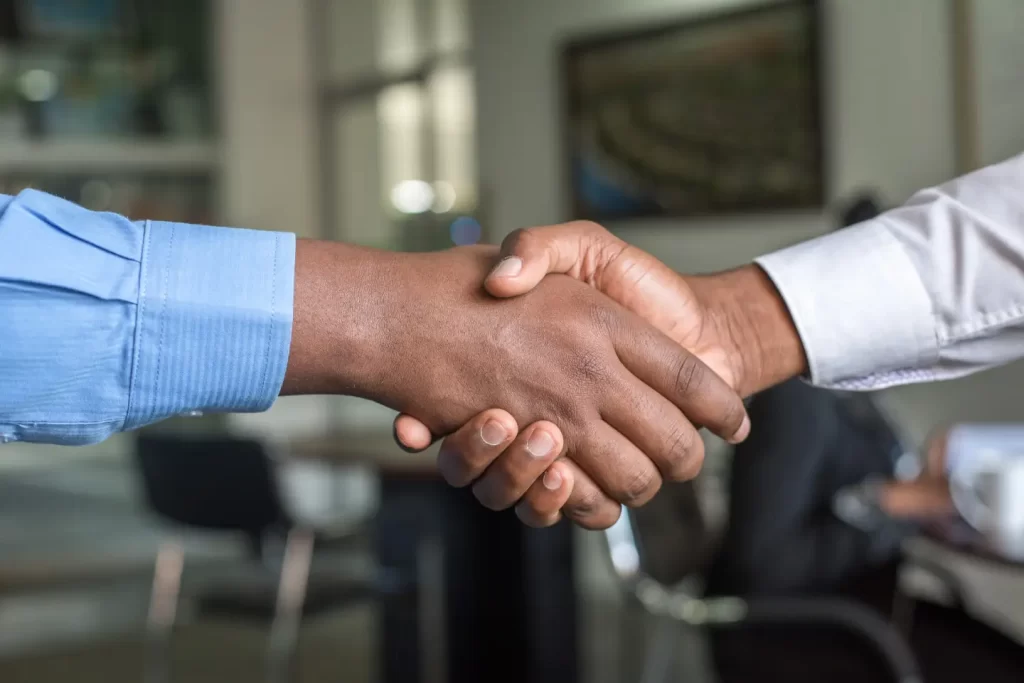 two-in-suit-person-handshake