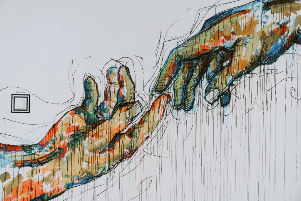 two-human-hands-painting