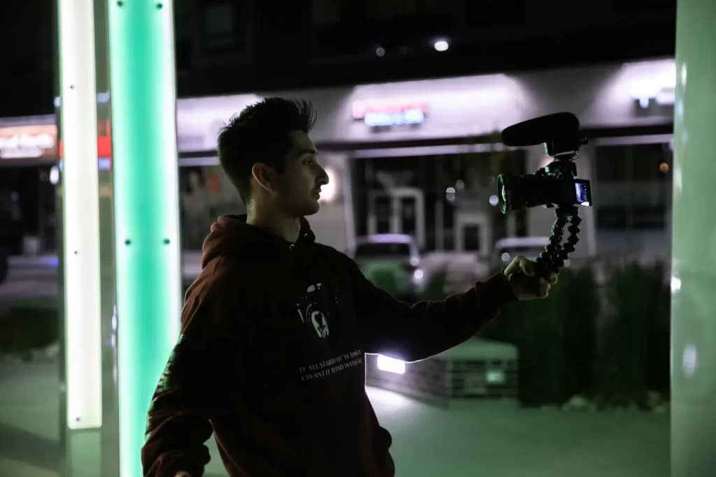 man-using-camera-during-nighttime