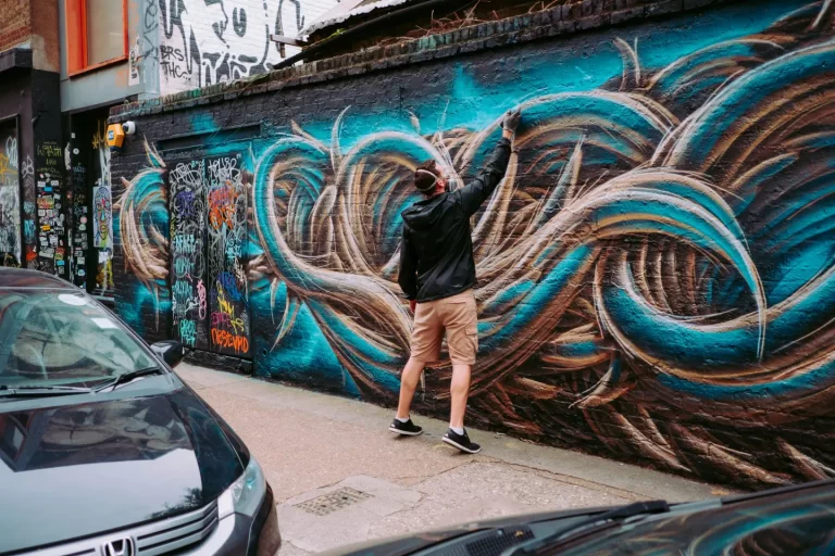 man-painting-on-wall-during-daytime